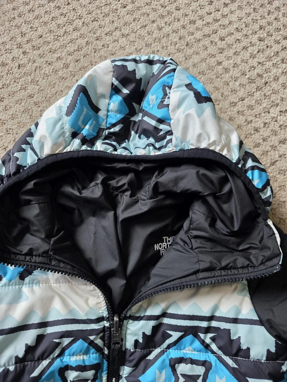 The North Face Girls' Reversible Blue Patterned And Black Puffer Jacket